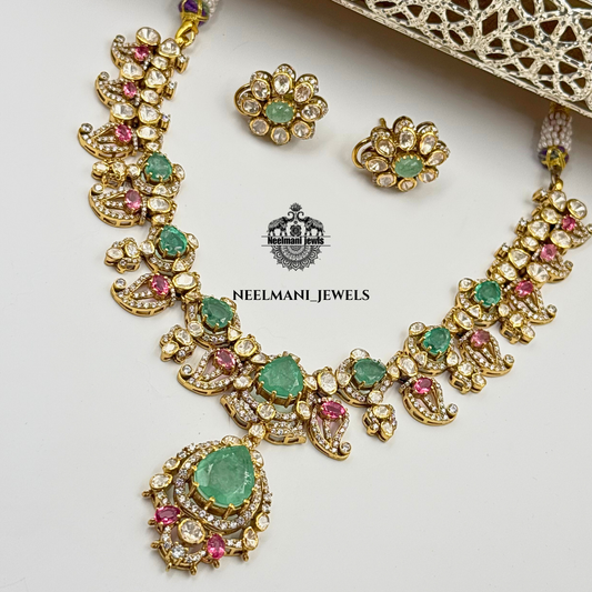 Neelmani Jewels necklace and earrings set on a white background