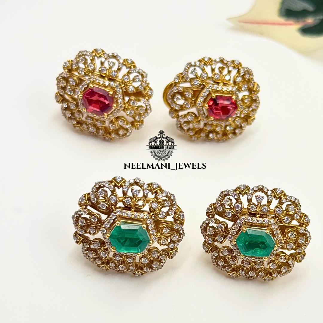 Gold earrings with red and green gemstones on a white background, branded as Neelmani Jewels.