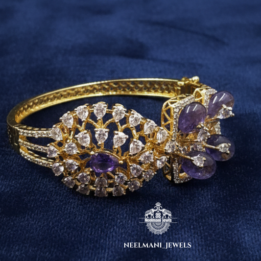 Gold bracelet with purple stones on a blue background, branded as Neelemani Jewels.