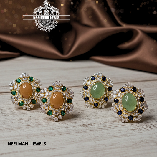 Neelmani Jewels earrings on a wooden surface with a brown fabric background