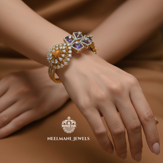 Elegant bracelet with gemstones on a wrist, branded 'Neelamani Jewels'.