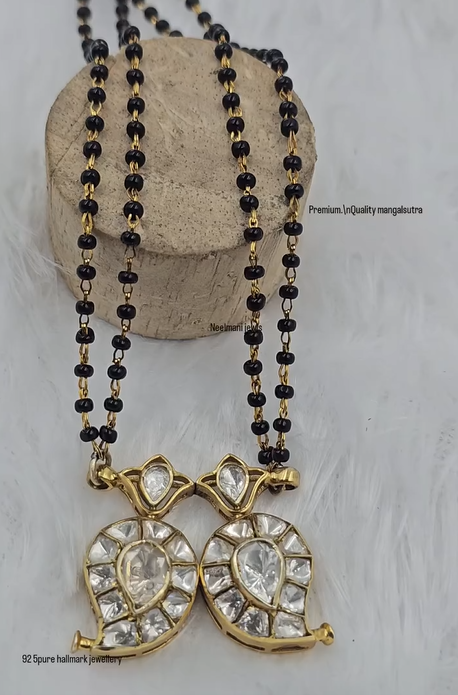 Indian traditional mangalsutra necklace with double leaf shaped pendant and black bead chain