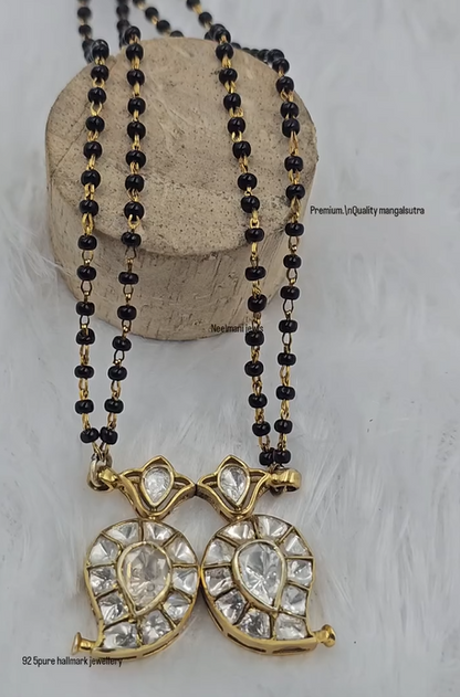 Indian traditional mangalsutra necklace with double leaf shaped pendant and black bead chain